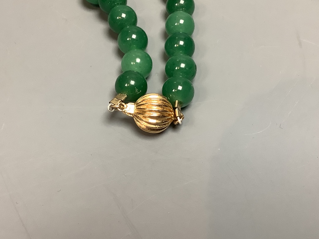 A single strand simulated jade bead necklace with 14k clasp